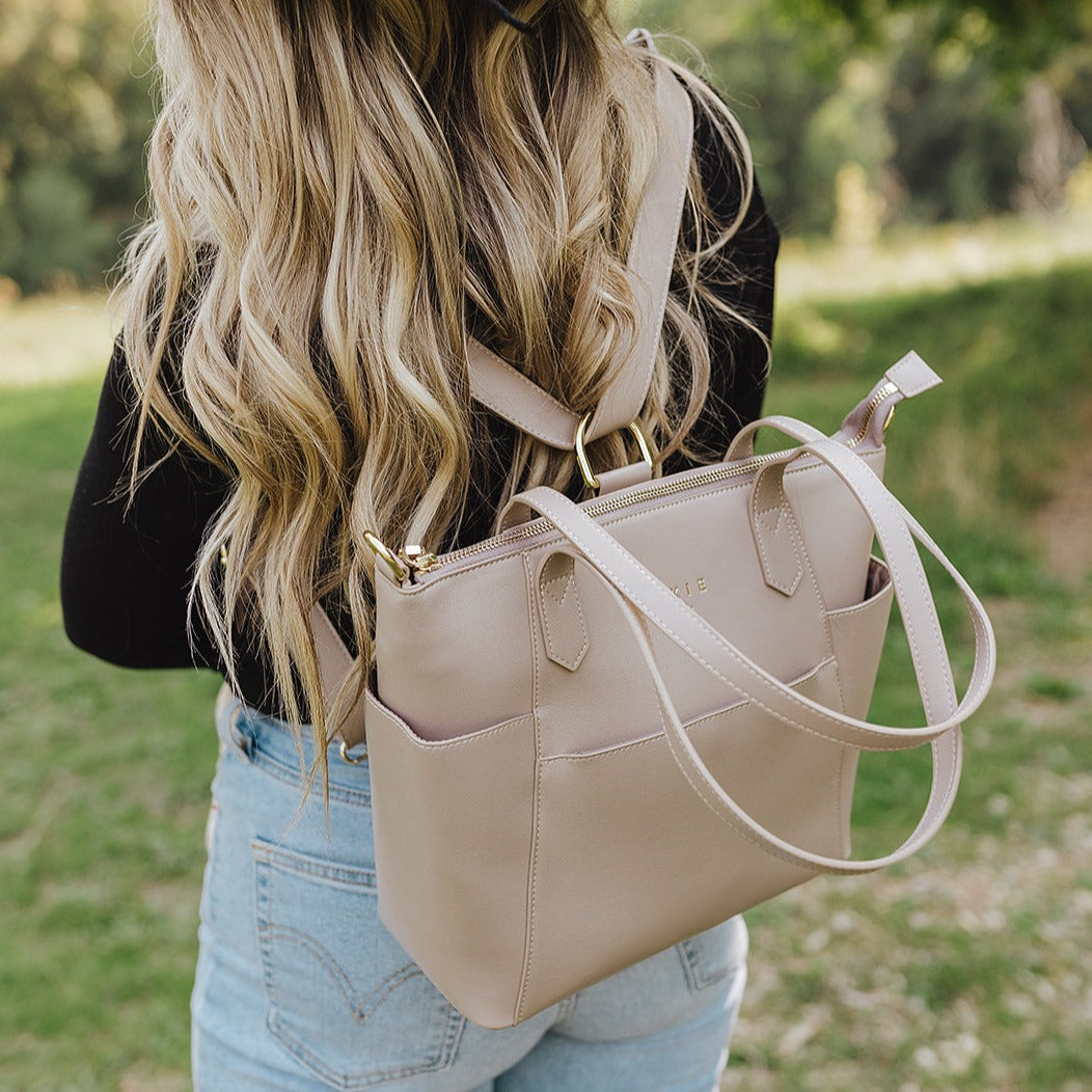 Taupe cairo being worn as a backpack