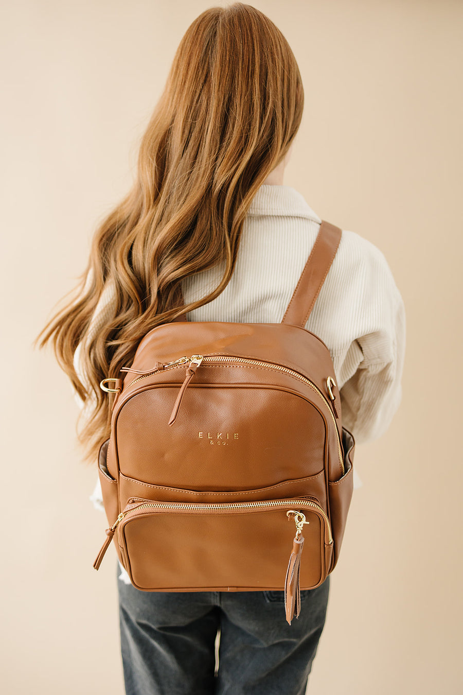 Ekie Co Saddle Aspen Midi being worn as a backpack