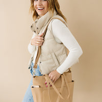 Tan Cairo being worn as a crossbody