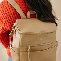 woman wearing Tan capri as backpack