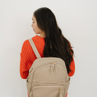Ekie Co Taupe Aspen Midi being worn as a backpack