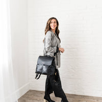 Woman wearing Ebony Milan backpack as crossbody