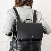 Woman wearing Ebony Milan backpack on back
