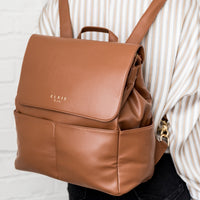 Elkie Co Saddle Milan Diaper Bag being worn on womans back